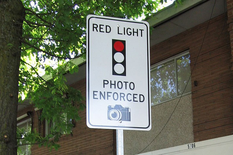 Red light camera sign